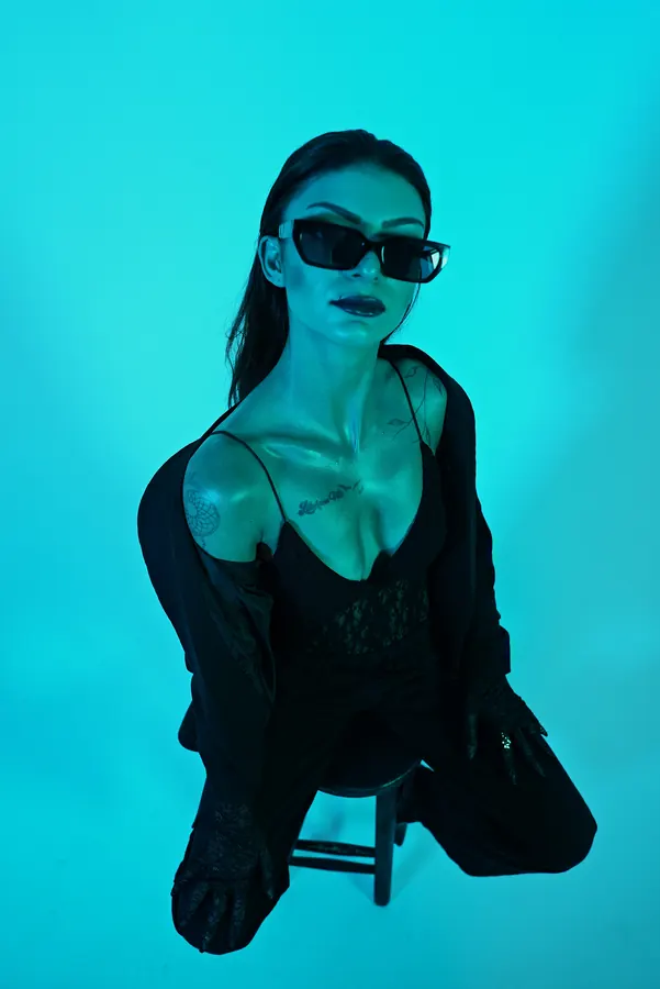 Black Suit — colour-gel studio fashion portrait by photographer Soner Erdoğan