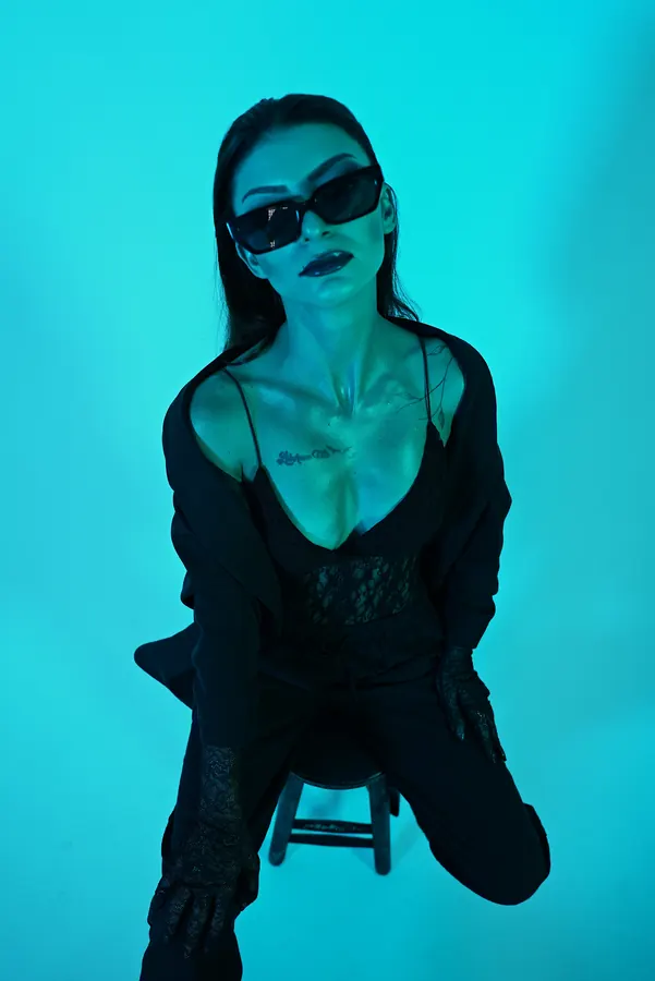 Black Suit — colour-gel studio fashion portrait by photographer Soner Erdoğan